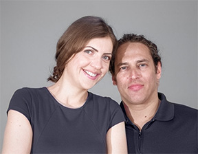 Founders of MOBILESTYLES Husband and wife founders of MOBILESTYLES smile in front of gray background