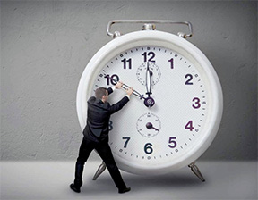 Giant timer Giant timer with a man pulling down one of the clock hands